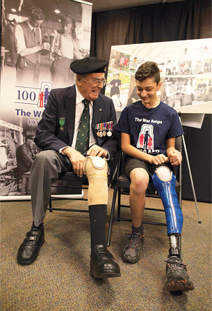 Second World War amputee veteran and War Amps member Charlie Jefferson with Champ Dante at the Canada Post commemorative envelope unveiling in Ottawa
